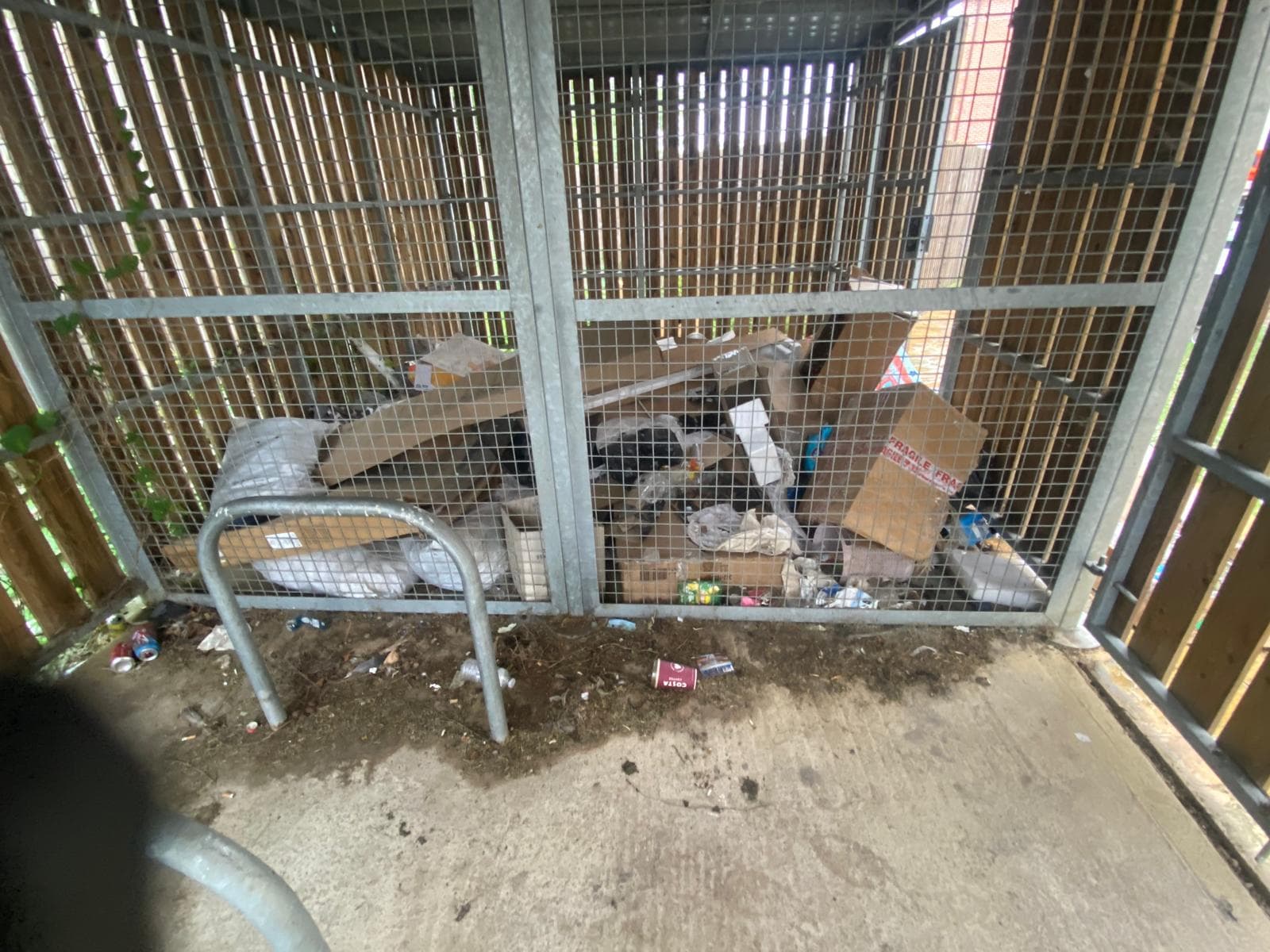 Overflowing bin store before clearance, ready for a garage or shed clear-out