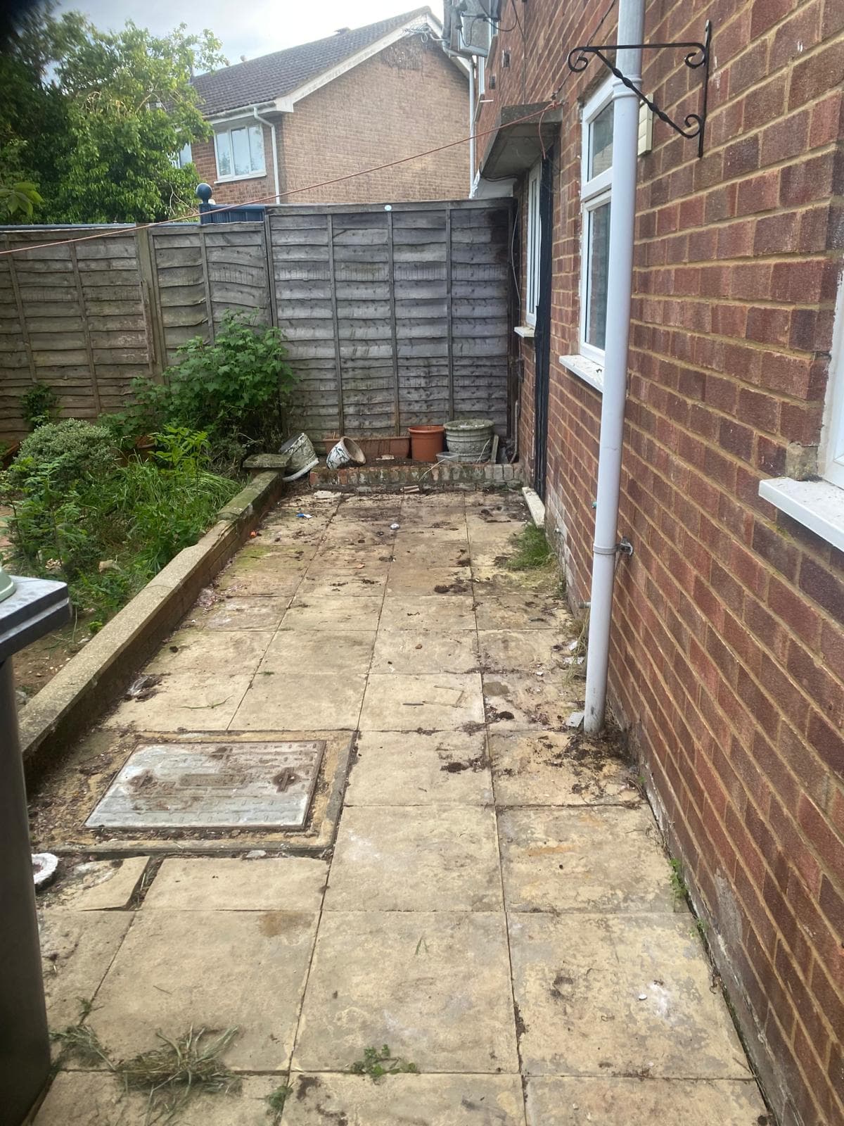 Patio area cleared and swept after a clearance