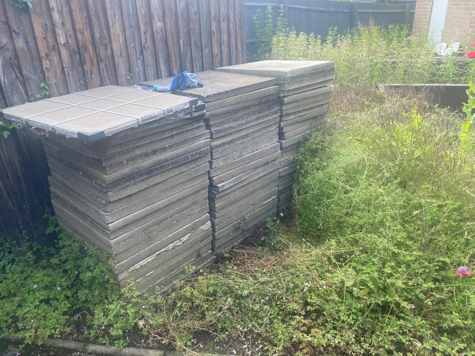 Large stack of paving slabs ready for collection