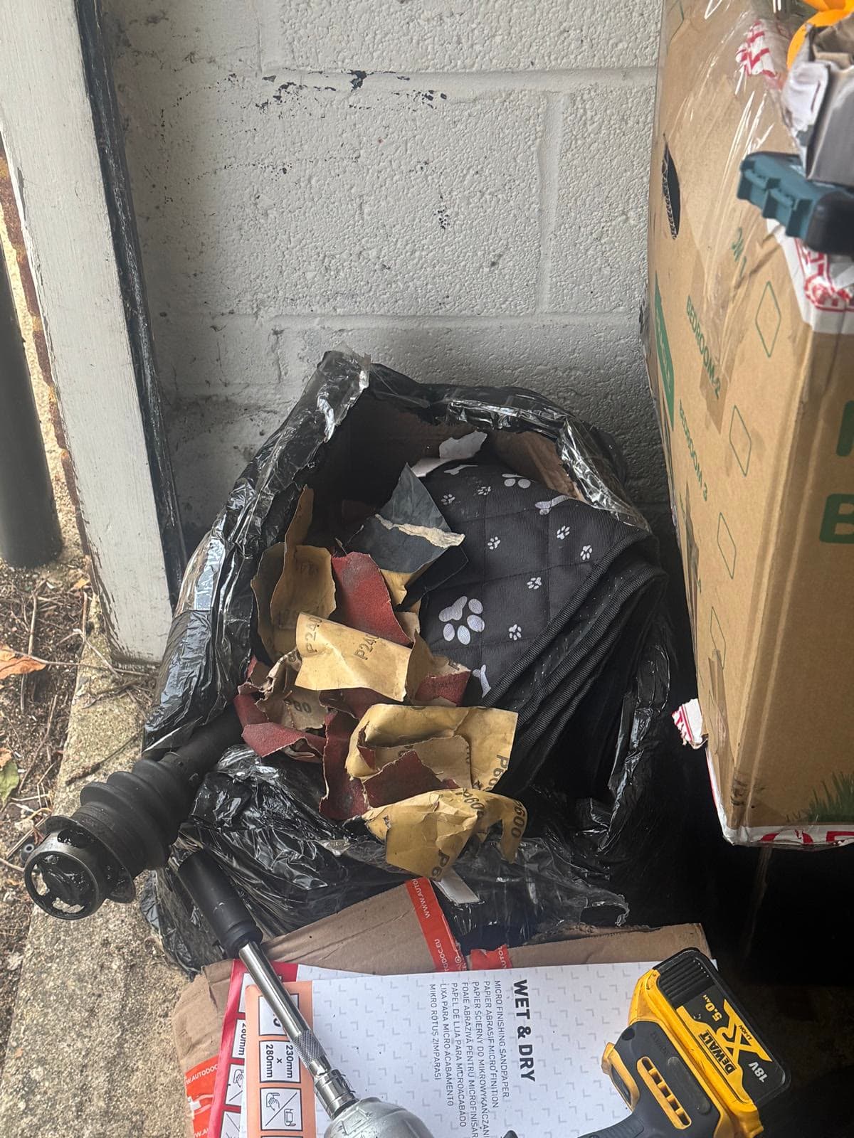 Old car driveshaft and garage waste cleared out