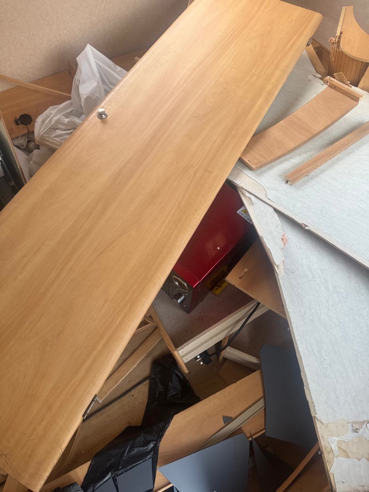 Caravan interior with units and panels removed during a strip-out