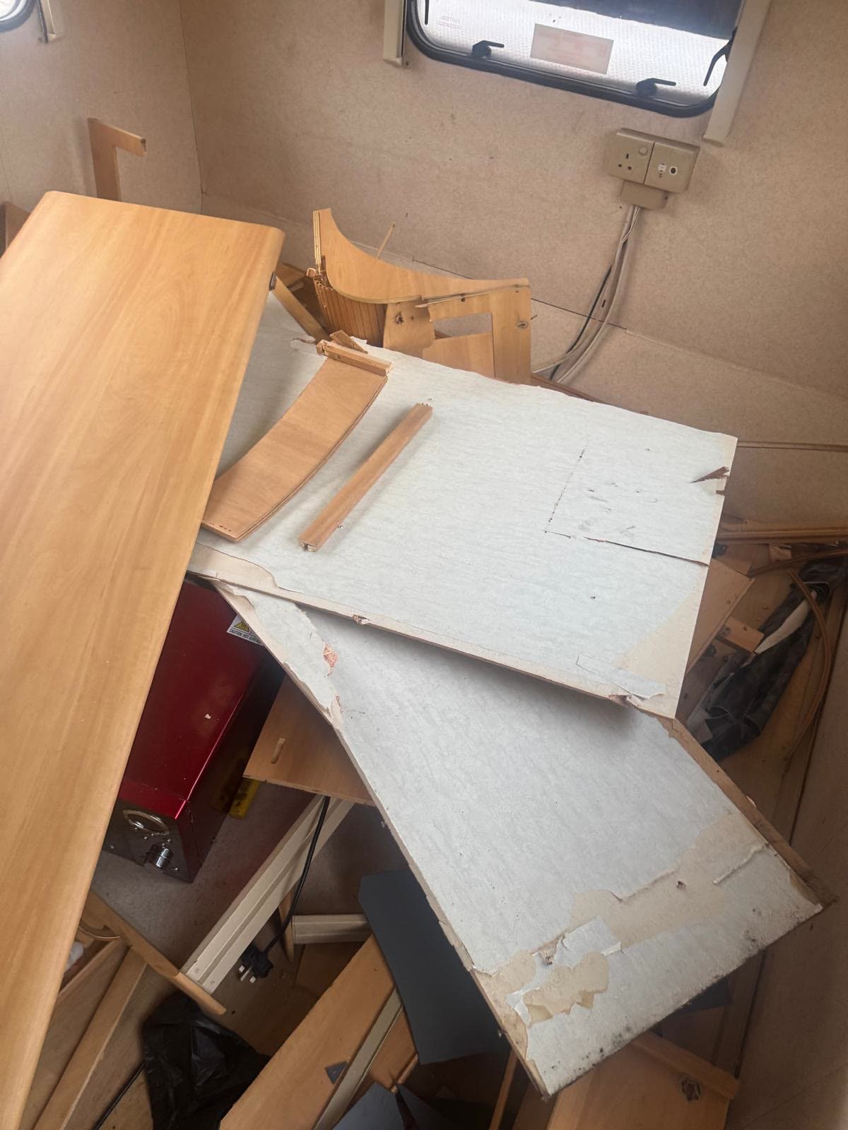 Caravan interior cleared of cabinets and fittings