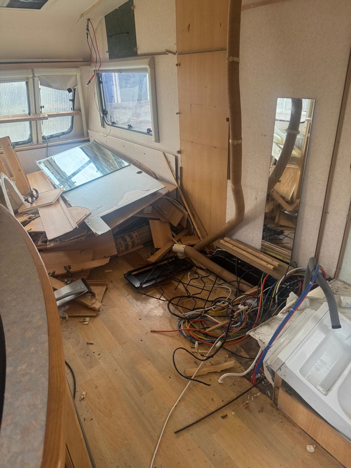 Caravan living area cleared during an interior strip-out