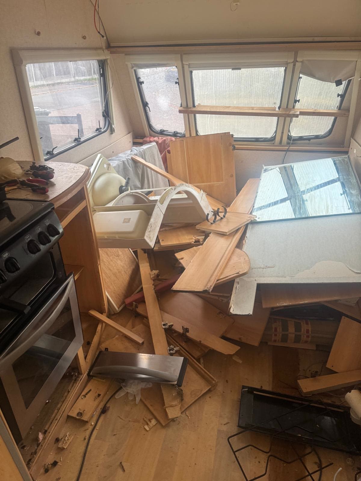 Caravan kitchen with cooker and units cleared