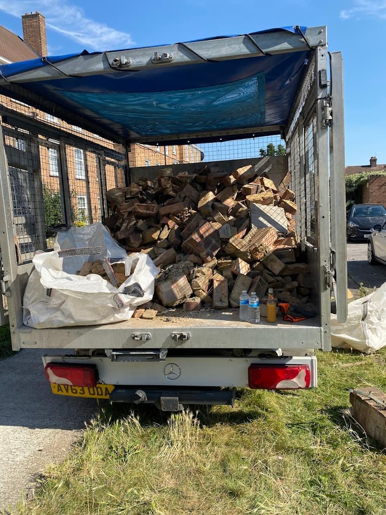 Truck loaded with bricks and timber