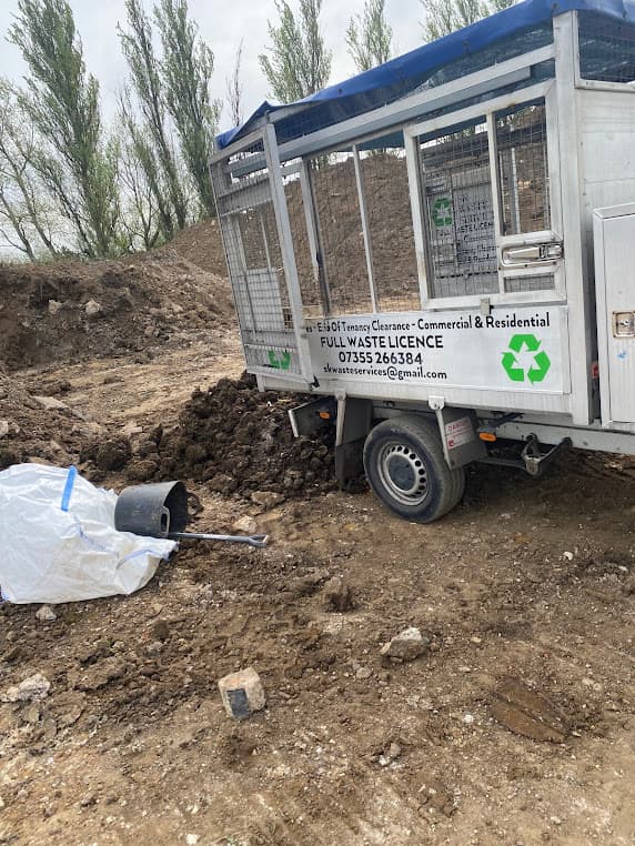Loading waste onto truck on site