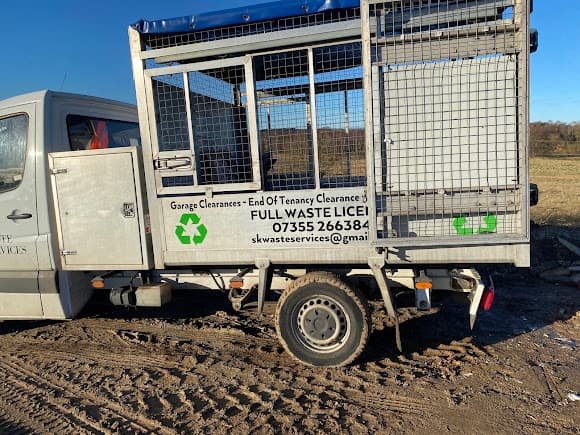 SK Waste Services truck on a clearance site