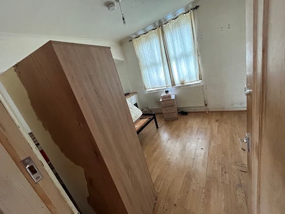 Bedroom with wardrobe before clearance