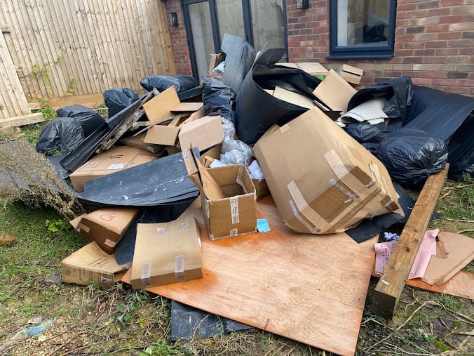 Cardboard and household waste pile